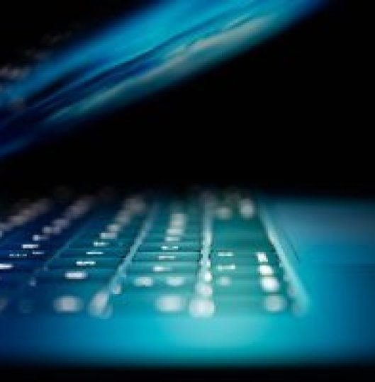 Open, lit laptop - ServMe IT